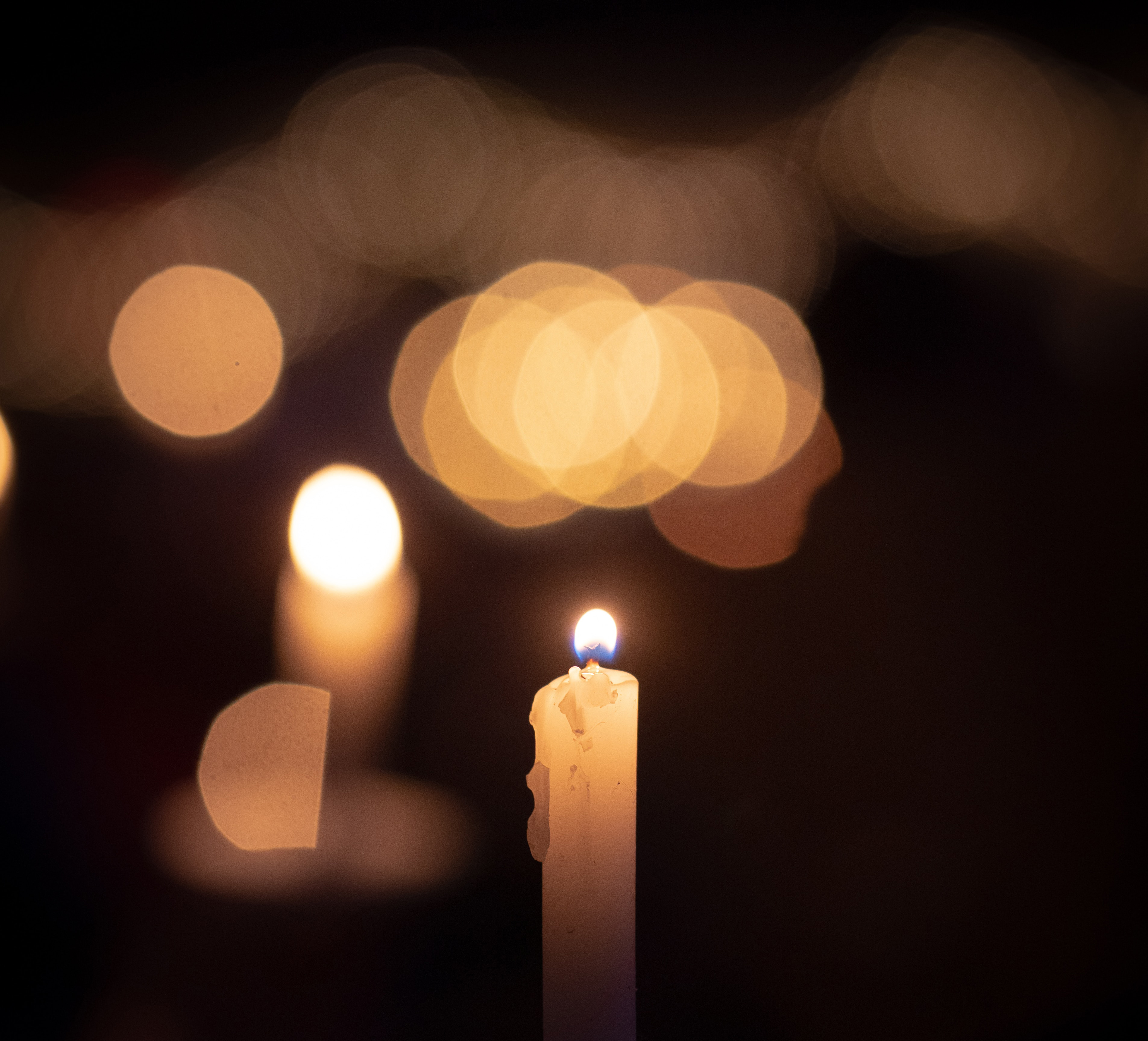 Candlelight giving shimmering effect in the dark